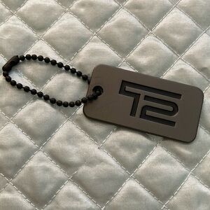 Tumi T2 metal tag fob for bag